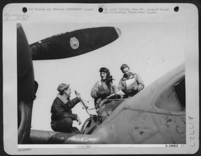 Thumbnail for Operations & Mapping > 1st Lt. Russel J. Myktyn (center) of Central Falls, R.I., Photo Reconnaissance pilot of the 9th Air Force makes a last minute check with Sgt Charle E. Kurtz (left) of Philadelphia, Pa., and crew chief Sgt Edwin R. Pietka (right) of Detroit, Mich.