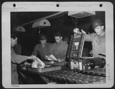 Thumbnail for Processing > This is a section of the printing room of a Photo Recon Unit of the 9th AF. Left to right are: Cpl Ralph W. Libby, Banger, Maine; M/Sgt John H. Strobel, Louisville, Ky.; Cpl Marvin A. Darmstadter, Philadelphia, Penn.; and Sgt Louis P. Morse, Mobile