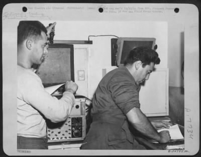 Thumbnail for Processing > Two 9th AF enlisted men, Harris Levy (left) of N.Y.C. prints and Martin H. Stoll, of Brooklyn, N.Y., develops the prints in a Photo Recon Unit Lab at a 9th AF base somewhere in France.