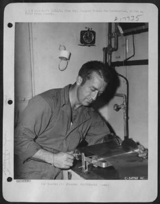 Processing > Sgt Robert S. Campbell of Connelsville, Ohio, prepares film for development, at a Photo Recon Lab of a 9th AF Unit in France.