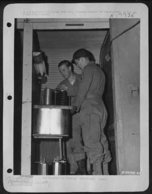 Processing > Sgt James J. Duffy of Kearny, N.J., and M/Sgt John H. Strobel (lab chief) of Louisville, Ky., are at work in a Lab at a 9th AF base in France.