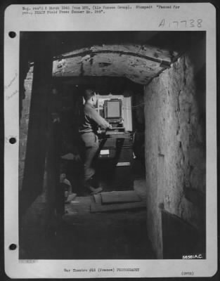 Thumbnail for Processing > When a reconnaissance group of First Tact AF moved into this advanced air base the only available space for their photo laboratory was the dark wine cellar of an old French chateau. The technicians removed the cobwebbed bottles and casks (which