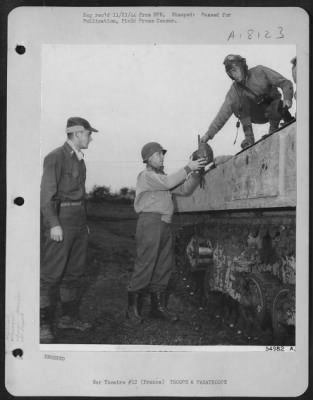 Thumbnail for General > To assure top-notch coordination of tank and dive-bomber tactics during smashes at the Siegfried Line, the 9th Air Force in France is assigning number of pilots to armored units. The pilots ride with the tanks, directing air support. One of the