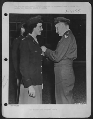 Thumbnail for General > Lieut Gen. Carl Spaatz, Commanding General of the U.S. Strategic Air Forces in Europe, presents the Legion of Merit to Capt. Sarah Ann Bagby, New Haven, Missouri, for her "exceptionally meritorious conduct in the performance of outstanding services."