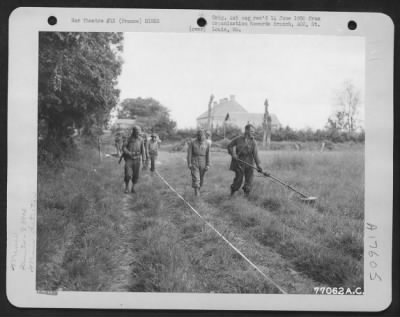 Thumbnail for Mines > A Field At St. Pierre Du Mont, Normandy, France, Is Searched For Mines And Booby Traps By A Member Of The 834Th Engineer Aviation Battalion With The Use Of A Mine Detector.