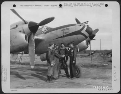 General > The Pilot And Ground Crew Of The 367Th Fighter Group, Beside Their Lockheed P-38 'Situation Normal' At An Air Base In France.  7 October 1944.