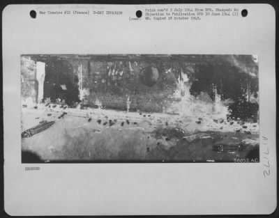 Thumbnail for General > Avoiding The Great Craters Left By Bombs Of The 8Th Aaf, Landing Craft Nose Into The Shore Somewhere Along The Beachhead On The Coast Of Nazi Held France.  Army Vehicles Dotting The Shore Shown In This 8Th Air Force Reconnaissance Photo.