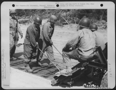 Thumbnail for Construction- Airfields > Just A Few Miles Behind The Front Lines In Normandy, France, Men Of The 9Th Air Force Aviation Engineers Constructed Emergency Landing Strips With 'Hessian Mat' Used For Surfacing.  After The Selected Site For The Airstrip Is Graded And Leveled, The Mat,