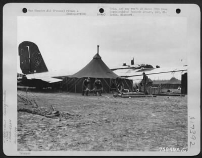 Thumbnail for Installations > With A Captured German Plane As A Background, Members Of The 439Th Troop Carrier Group Complete Work On Their Living Quarters At An Air Base Somewhere In France.  25 November 1944.