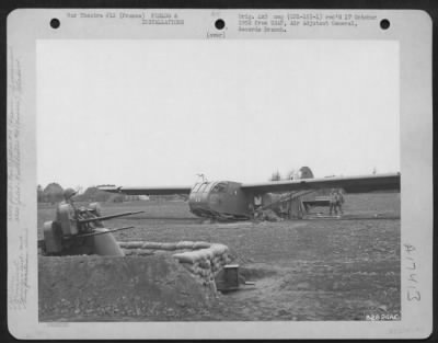 Thumbnail for Miscellaneous > At An Air Base Somewhere In France, Anti-Aircraft Crew Members Make Their Temporary Living Quarters Under Wing Of Cg-4 Glider.  1 April 1945.