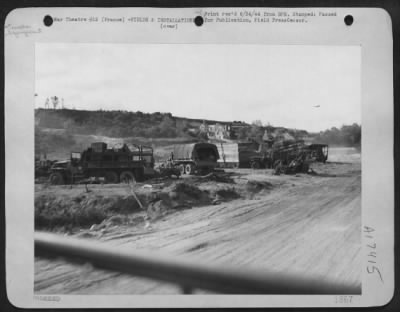 Thumbnail for Supplies > 'Somewhere In France' -- Working On A 24-Hour Schedule, Trucks Of The 9Th Air Force Service Command Carry Supplies From The Beachhead To The First American-Built Landing Strip On The Continent.  They Are Shown In Their Improvised Motor Pool Below A House,