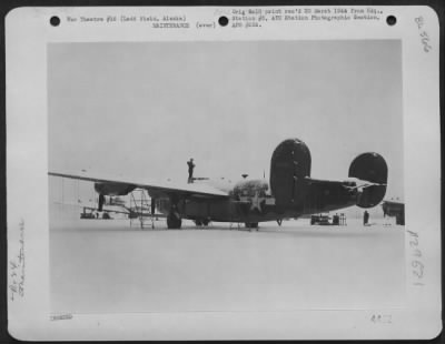 Thumbnail for Consolidated > A mechanic sweeps snow off a Consolidated B-24 at Ladd Field, Alaska, 15 February 1944.