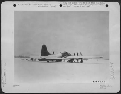 Thumbnail for Consolidated > A mechanic sweeps snow off a Boeing B-17 at Ladd Field, Alaska, 15 February 1944.