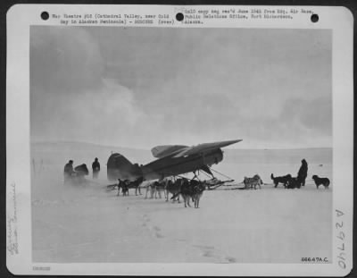 Consolidated > Ready For The Take-Off, The Most Seriously Injured Man If The Wrecked Douglas C-47 In Cathedral Valley, Alaska And His Surgeon Are Flown Out First In A Stinson Commercial Ski Plane.