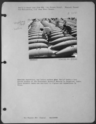 Thumbnail for Consolidated > American Supervisor, And Indian Workmen Give 'Belly' Tanks A Last Minute Checkup At The Hindustani Aircraft Factory In Bangalore, India.  These Dropable Tanks Are Destined For Fighter And Bomber Planes In China.