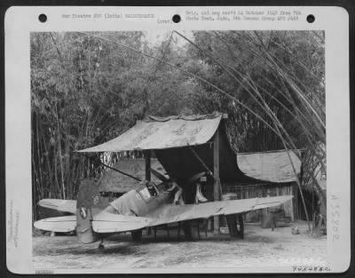 Thumbnail for Consolidated > Cpl. James Simon From Wadworth, Ohio Works On A Curtiss P-40 Parked Under Engine Hoist At Lilibari Field, Lilibari, India, 16 March 1943.