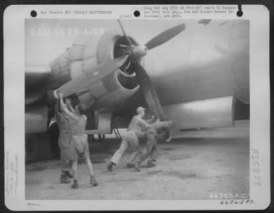 Thumbnail for Consolidated > Ground Crew Of A Boeing B-29 Of The 462Nd Bomb Group, Xx Bomber Command, Turning Over The Motor Before Take-Off On Mission 9 To Anshan, Manchuria.  India.