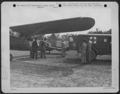 Thumbnail for Consolidated > One Of The Men Injured During The Japanese Attack On Broadway Field, Burma Is Placed In An Ambulance At Hailakandio, Assam, India, During The Evacuation Of The Wounded. 1St Air Commando Force.