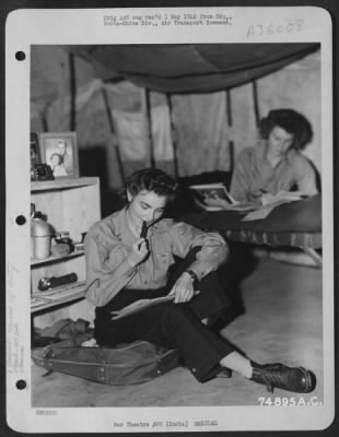 Consolidated > While Not On Duty These Two Nurses At 1333Rd Aaf Base Unit, Air Transport Command, Take Time Out To Write To Their Loved-Ones Back Home.  Assam, India.