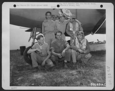 Consolidated > 9th Air Force crew members by their plane in North Africa. 1943.