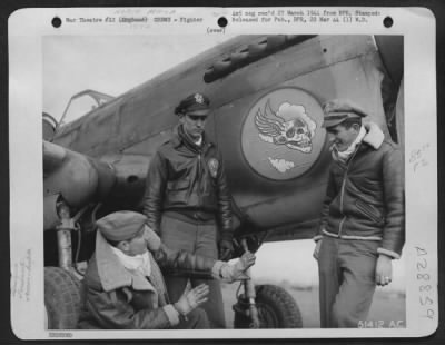 Thumbnail for Consolidated > "Flying Skull" Squadron pilots telling each other how they knocked down one enemy aircraft apiece . . . Left to right: Lt. Robert J. Duffield, 24, Cleveland Heights, Ohio--- shot down an FW 190 to make his 2nd victory; Lt. Raymond Higgins, 20