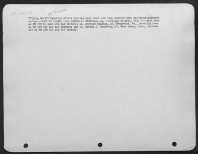 Thumbnail for Consolidated > "Flying Skull" Squadron pilots telling each other how they knocked down one enemy aircraft apiece . . . Left to right: Lt. Robert J. Duffield, 24, Cleveland Heights, Ohio--- shot down an FW 190 to make his 2nd victory; Lt. Raymond Higgins, 20