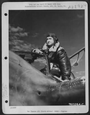 Thumbnail for Consolidated > Lt. Ballard, pilot of the 90th Photographic Reconnaissance Wing, poses in the cockpit of his Lockheed F-5 at an air base somewhere in North Africa.