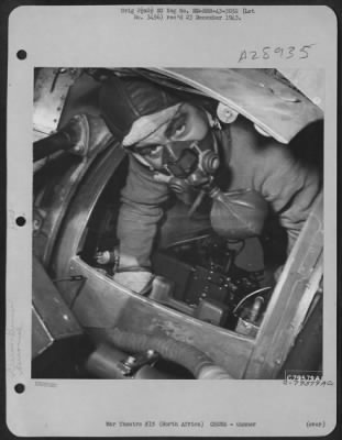 Consolidated > Sgt. Arthur B. Raymond, ball turret gunner from Oak Park, Illinois, at his position in his plane before take-off from his base somewhere in North Africa. 29 July 1943.