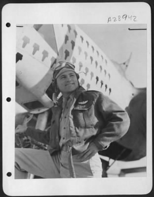 Thumbnail for Consolidated > Lt. /Col. Leon Gray, Operations Officer of the 3rd Photo Group during the Tunisian, Pantalleria and Sicilian campaigns standing in front of his F-5 Photo-recon plane. He rolled up a total of 73 missions before being returned to the U.S. From Oct.