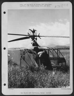 Consolidated > Sikorsky Yr-4 ['.. Whirlaway'] Helicopter Pilot Lt. Irvin C. Steiner, Assembles His Tools And Paints For Salvaging Instruments And Marking The Wings Of A Crashed Plane Near Myitkyina, Burma.