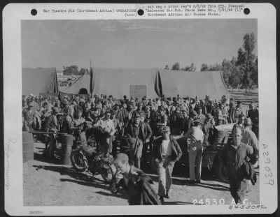 Consolidated > Northwest Africa. From an Advance North African Air Base-July 13, 1943-North American Mitchell B-25 crews leave recently completed briefing for Gerbini landing grounds in Sicily.