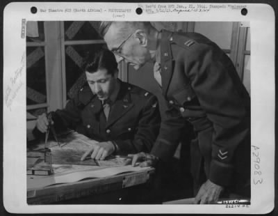 Consolidated > Photo interpretation plays an important part in the operations of the army, navy, and air forces. The aerial photos are carefully checked & reveal valuable information. Here Capt. Audabon Tyler, St. Augustine, Fla., who spent fifteen months overseas