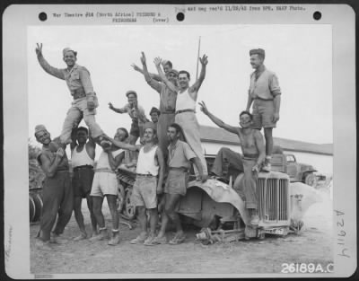 Thumbnail for Consolidated > AN ADVANCED AIR BASE, NORTH AFRICA--Italians celebrate: Happy over the capitulation of Italy, Italian prisoners of war at Boeing B-17 Flying Fortress headquarters in North Africa, could hardly restrain themselves when informed of the news during