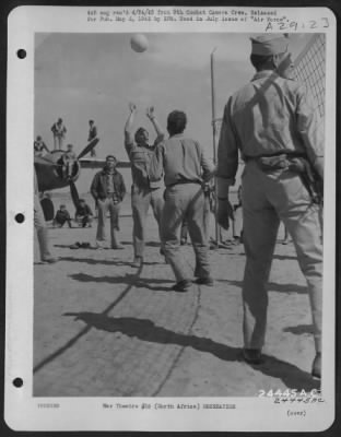 Consolidated > North Africa. Members of the Earthquakers bomb group of the United States Army Air Force in North Africa play volley ball between missions.