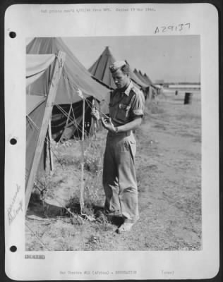 Thumbnail for Consolidated > 1st Lt. Robert E. Ward, of Los Molinos, Calif., working on a string belt.