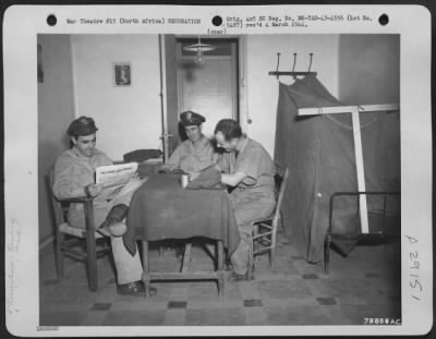 Consolidated > Officers relax in the Mediterranean Air Transport Service, British, officer's billets at La Senia Airport, La Senia, North Africa. 2 October 1943.