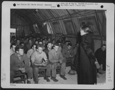 Consolidated > Retreat is held by Chaplain Francis X. Singleton in the briefing room of the 98th Bomb Group at their base somewhere in North Africa. 24 May 1943.