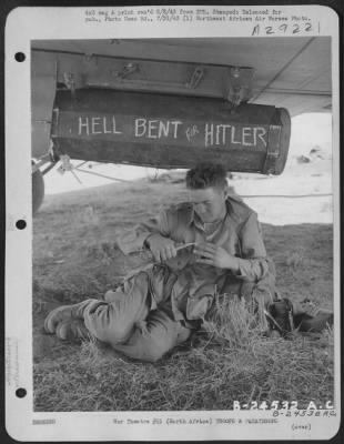 Consolidated > Paratrooper Pvt. Thomas E. Lane of Fort Worth, Texas, relaxes under transport during alert prior to invasion and capture of Sicilian airfields.