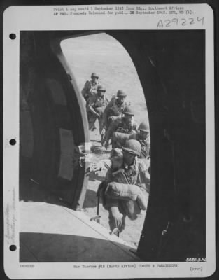 Consolidated > Paratroopers enter plane. NORTH AFRICA.