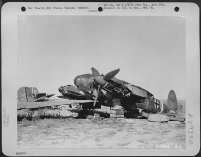 Thumbnail for Consolidated > Tunis, Tunisia-Axis planes totaling over 250 were left by the enemy in their hasty retreat from El Aouina Airdrome during the battle of Tunisia. Many German aircraft were destroyed on the ground from the constant bombings from Allied planes. However