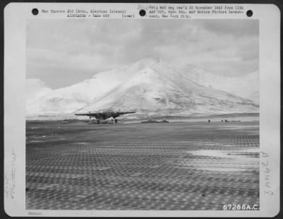 Consolidated > A North American B-25 Of The 11Th Air Force At Alexai Point Air Base On Attu, Aleutian Islands, Takes Off Against A Background Of Snow-Covered Mountains.  1943.