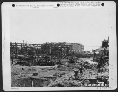 Consolidated > Bomb damage to machine shops located on eastern tip of Cavite, Luzon Island, Philippine Islands.