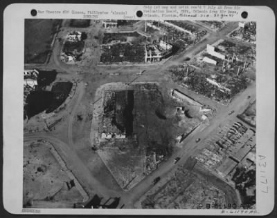 Thumbnail for Consolidated > Market area in Baguio, suffered one direct hit and two near misses. Note the small craters from light bombs-probably 100 pounders. Earth was of soft dirt. Luzon, Philippine Islands. 27 April 1945.