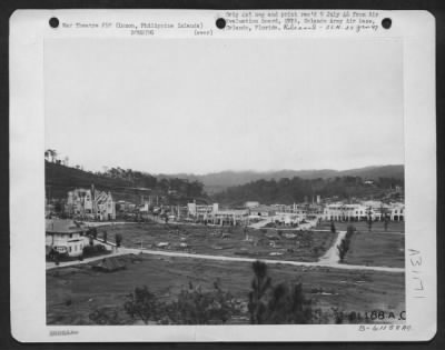 Thumbnail for Consolidated > This photo shows destruction to the city of Baguio by bombs. Luzon Island, Philippine Islands. 20 July 1945.