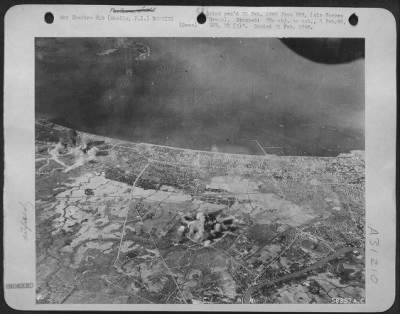 Thumbnail for Consolidated > Nichols and Neilson Fields, in Manila's inner defense zone, were of little use to the Japs after Consolidated B-24 Liberators of the 13th AAF finished battering them in the first strike against these objectives by land-based aircraft Nichols Field