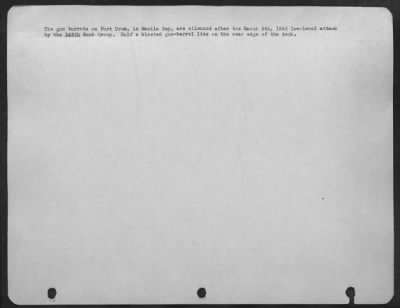 Consolidated > The gun turrets on Fort Drum, in Manila Bay, are silenced after the March 5th, 1945 low-level attack by the 345th Bomb Group. Half a blasted gun-barrel lies on the rear edge of the deck.