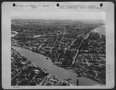 Thumbnail for Consolidated > Bomb damage in Manila, Philippine Islands, Feb. 1945. Intramuras District; Neilson Field, top center; Nichols Field, top right; and Manila Hotel, right center.