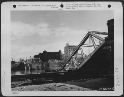 Thumbnail for Consolidated > View of a bomb damaged bridge at Manila, Luzon Island, Philippines. 16 March 1945.