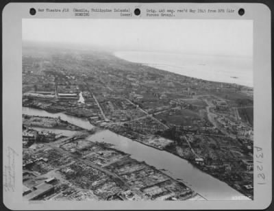 Thumbnail for Consolidated > All of the buildings of trade and commerce of the Far Eastern metropolis of Manila in the Philippine Islands were dynamited and burned by the retreating Japanese. This view, looking southwest, shows the badly damaged Ayala Bridge over the Pasig