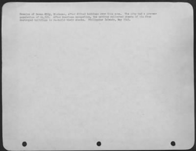 Consolidated > Remains of Davao City, Mindanao, after Allied bombings over this area. The city had a pre-war population of 24,521. After American occupation, the natives collected sheets of tin from destroyed buildings to re-build their shacks. Philippine Islands
